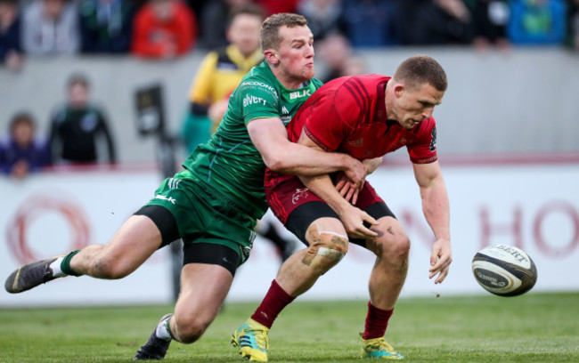 Stephen Fitzgerald dislodges the ball from the arms of Andrew Conway