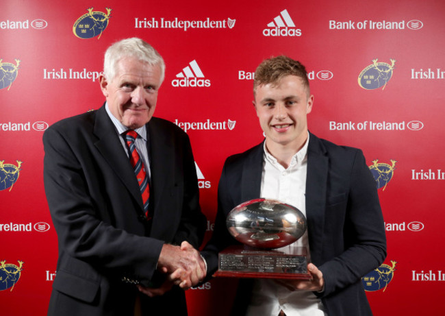 Craig Casey is presented with the John McCarthy award for Greencore Munster Academy Player of the Year from Dr. Paul McCarthy