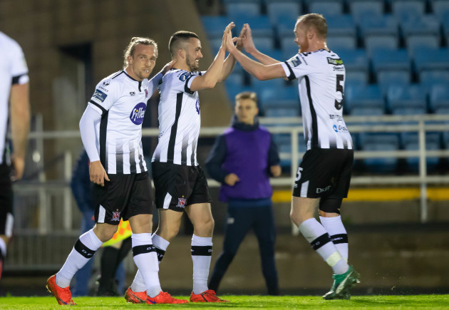 Dundalk players celebrate after Michael Duffy scores their third goal