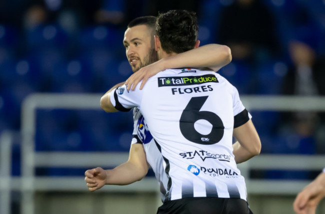 Michael Duffy congratulate goal scorer Jordan Flores