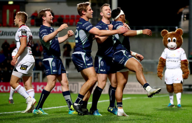 Jack Carty, Kyle Godwin and Matt Healy celebrates with try scorer Bundee Aki