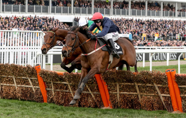 Mark Walsh on City Island wins the Ballymore Novices' Hurdle ahead of Barry Geraghty on Champ