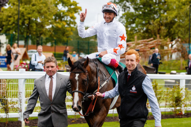 Frankie Dettori on Advertise celebrates winning the race