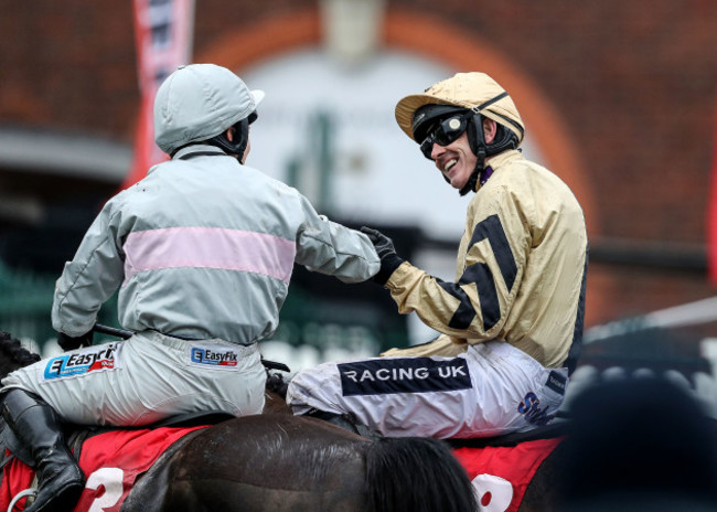 Ruby Walsh onboard Nichols Canyon is congratulated on winning the race by Katie Walsh onboard Clondaw Warrior