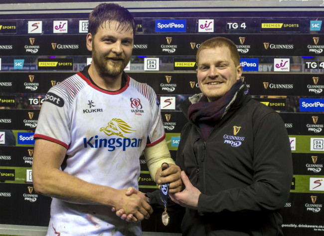 Iain Henderson is presented with the Guinness PRO14 Man of the Match award by Ryan Ewing