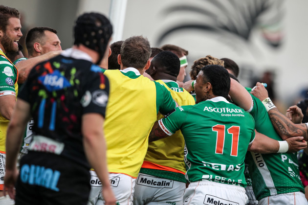 Benetton players celebrate a try