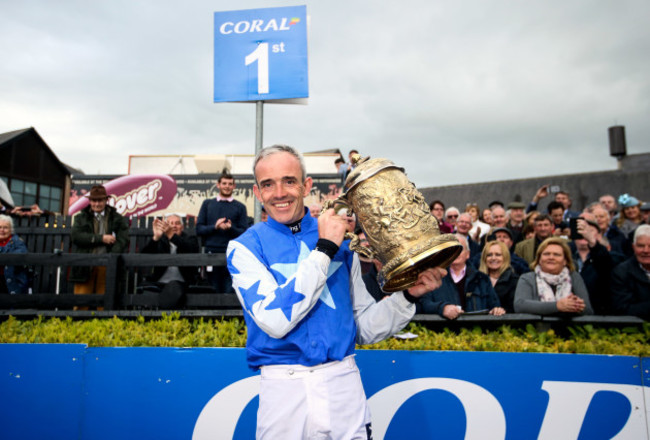 Ruby Walsh celebrates with the Coral Punchestown Gold Cup after winning with Kemboy
