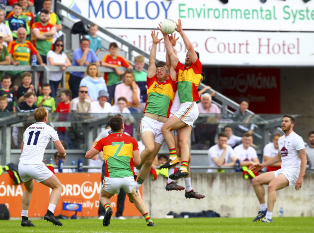 Players from Carlow and Kildare battle for possession in the air