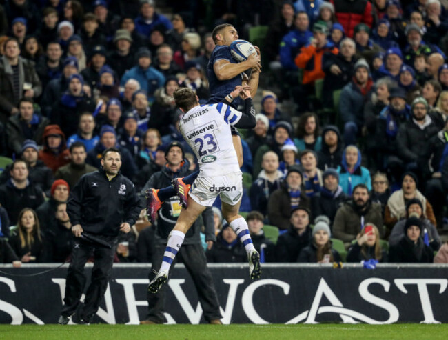 Adam Byrne claims a high ball ahead of Darren Atkins