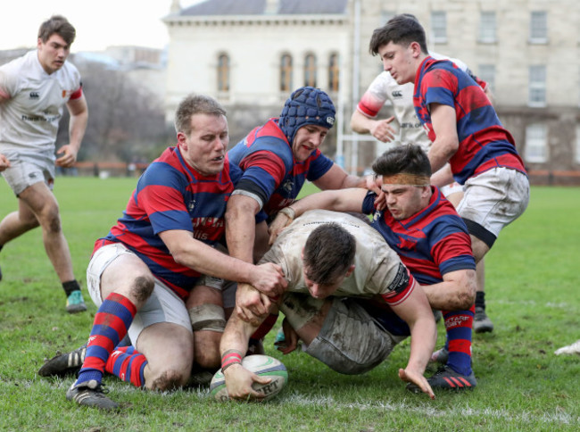 Dan Sheehan scores a try despite the efforts of Ben Reilly and Vincent Gavin