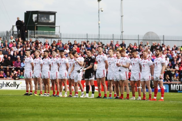 Tyrone players stand for the National Anthem