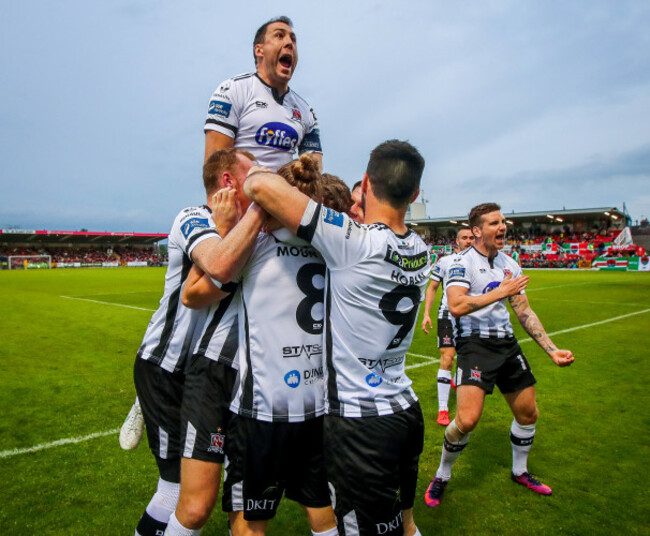 John Mountney celebrates scoring with his teammates