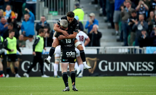 Adam Hastings and Stuart Hogg celebrate after Kyle Steyn scored their sides fifth try