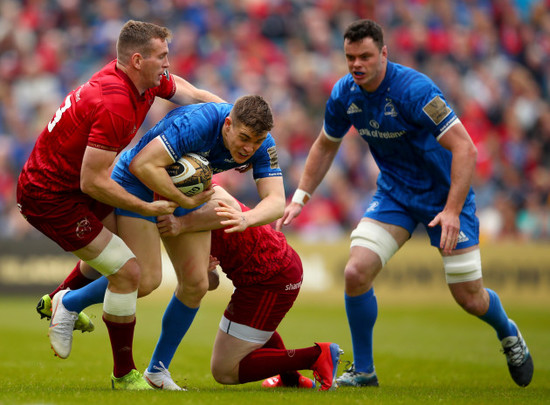 Chris Farrell and Rory Scannell tackle Garry Ringrose