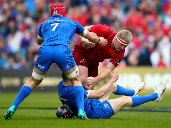 Josh van der Flier and Garry Ringrose tackle John Ryan