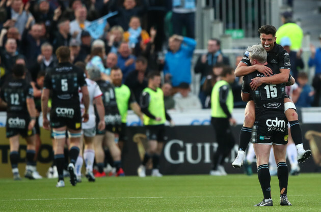 Adam Hastings and Stuart Hogg celebrate after Kyle Steyn scored their sides fifth try