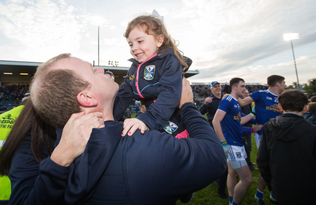Mickey Graham celebrates after the game with his daughter Lauren