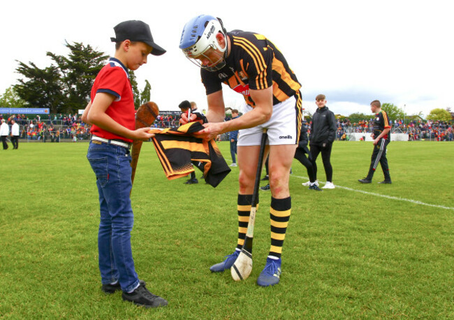 TJ Reid signs a supporters jersey at the end of the game