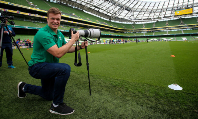 Josh van der Flier takes photos of the festival