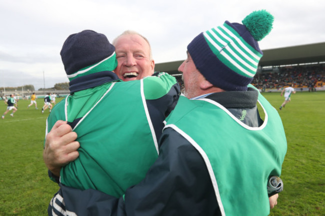 Joachim Kelly celebrates after the game with with his management team