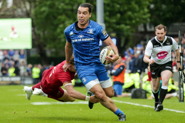 James Lowe in his way to scoring a try despite Mike Haley