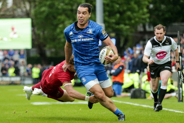 James Lowe in his way to scoring a try despite Mike Haley