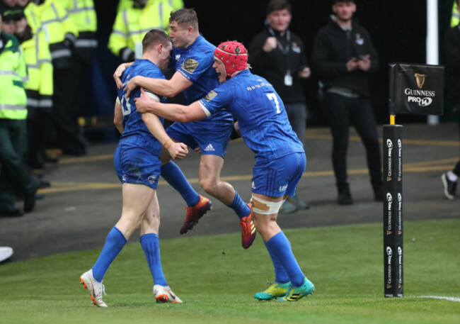Garry Ringrose celebrates his try with Jordan Larmour and Josh van der Flier