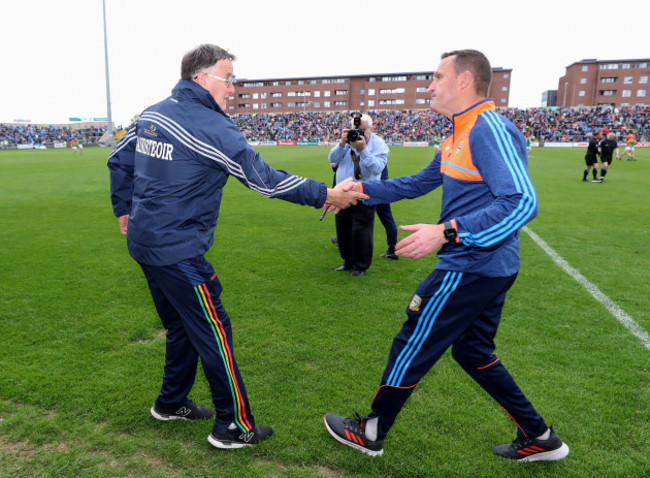 Tommy Wogan and Andy McEntee shake hands after the game