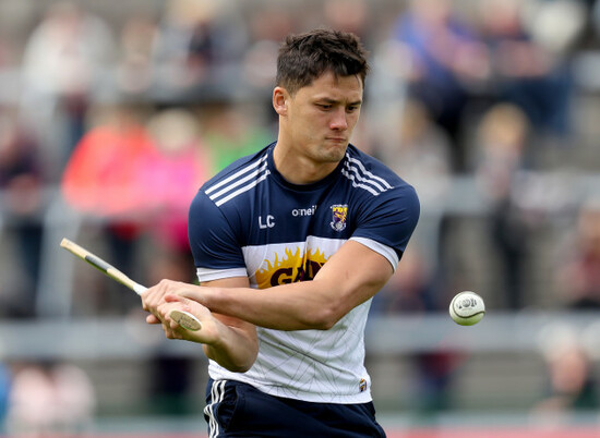 Lee Chin warms up before the game