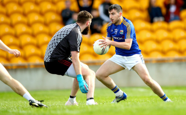 Mark Hughes scores his sides second goal despite goalkeeper Mark Donnellan