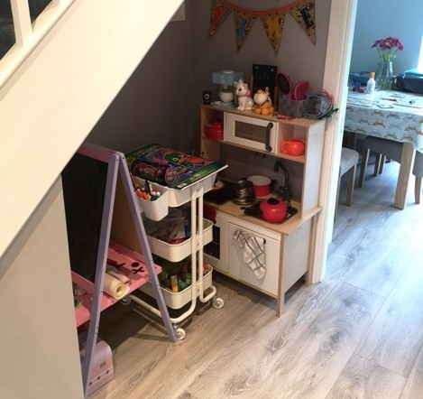 We set up a play area under the stairs Inside this toddler