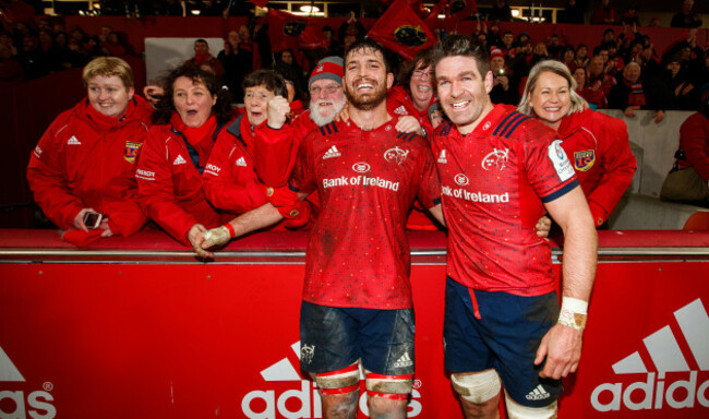 Billy Holland celebrates after the game with the choir and Jean Kleyn