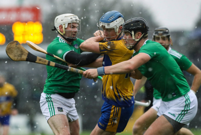 Diarmuid Ryan tackled by Paddy O'Loughlin and Tom Condon