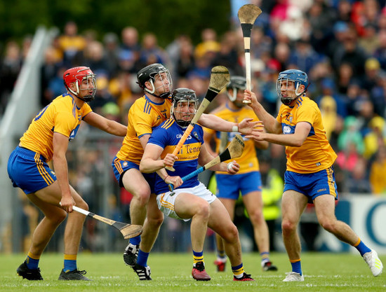 Peter Duggan, Tony Kelly and Shane O'Donnell tackle Dan McCormack