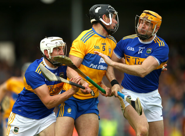 Patrick Maher and Seamus Callanan with Cathal Malone