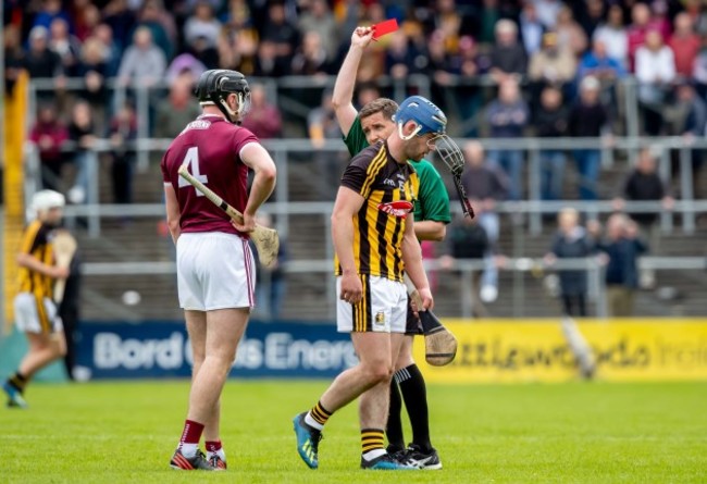 Ger Aylward is shown a red card by referee Colm Lyons