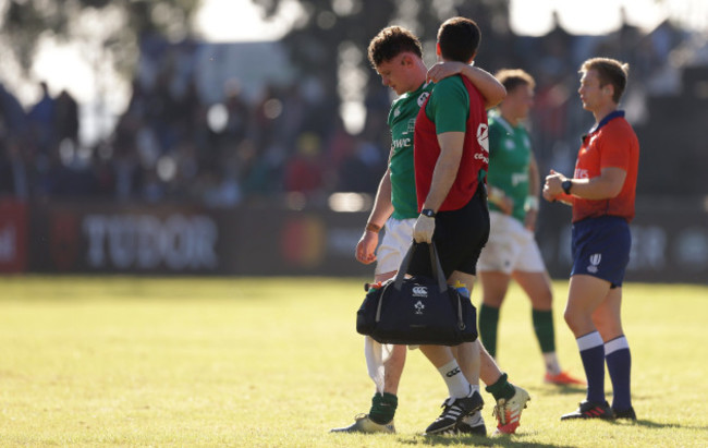 Ronan Watters leaves the field with an injury