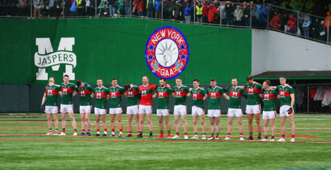 The Mayo team stand for a minutes silence