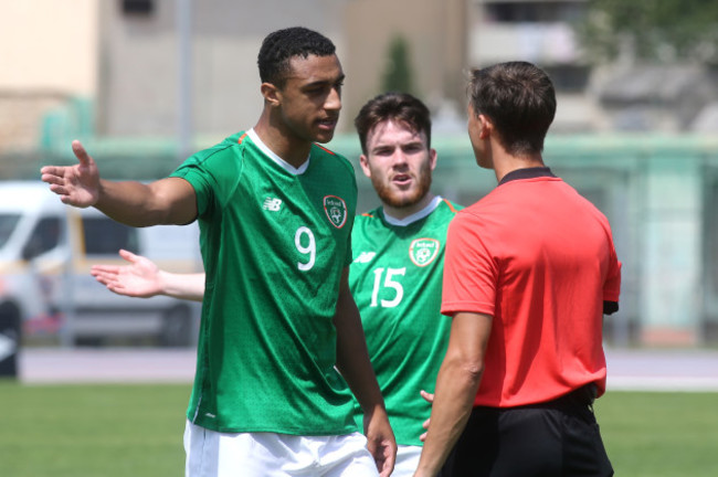 Adam Idah speaks with the referee after he ordered the retaking of a penalty