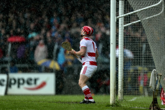 Anthony Nash looks on in the rain