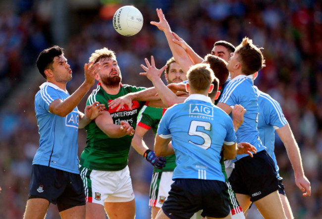 Cian O'Sullivan, Jonny Cooper and Michael Fitzsimons contest a high ball Aidan O’Shea and Andy Moran