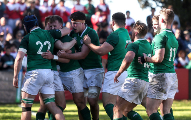 Stewart Moore celebrates scoring a try with teammates