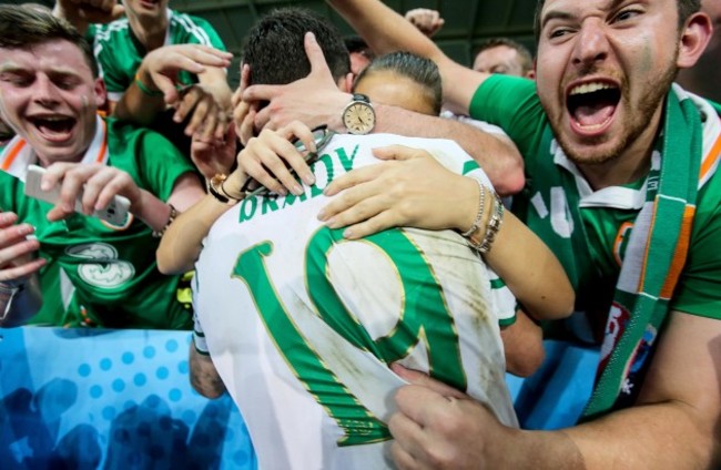 Robbie Brady celebrates with his girlfriend Kerrie Harris and supporters after the game