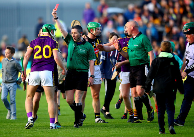 Aidan Nolan is red carded by ergal Horgan after the final whistle