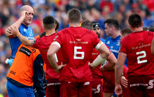 Conor Murray checks on an injured Devin Toner