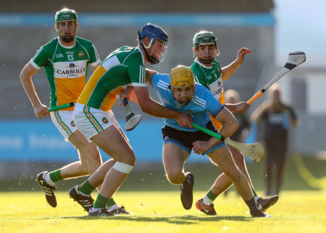 Diarmuid O'Floinn is tackled by Barry Kealey