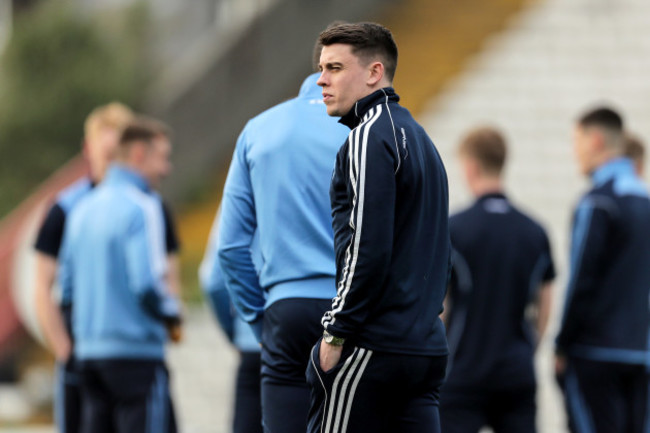 Gary O'Neill inspects the pitch ahead of the game