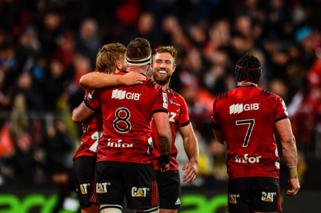 Crusaders players celebrate after the game