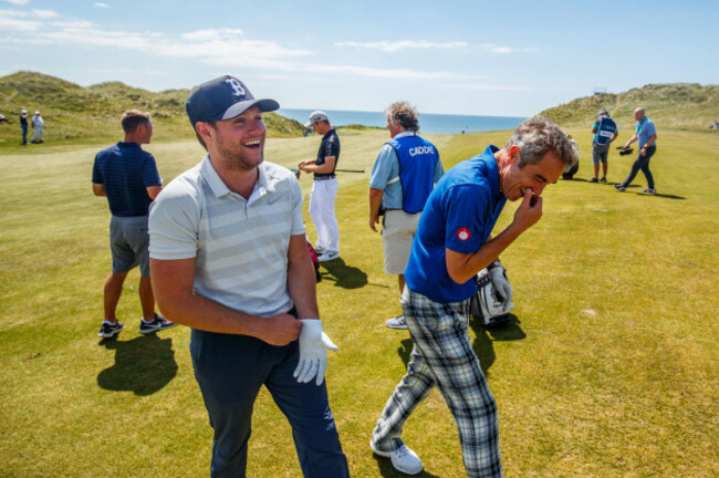 Niall Horan and James Nesbitt share a joke on the 6th fairway