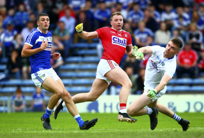 Brian Hurley shoots past Graham Brody to score a goal